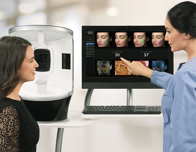 A medical professional educating a client of VISIA results